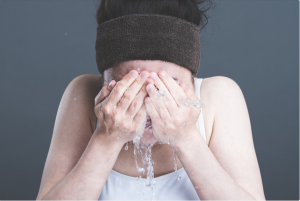 woman washing face
